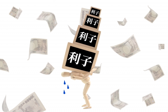 お金を手に頭を抱える。大野城市で債務整理の無料相談が弁護士にできます